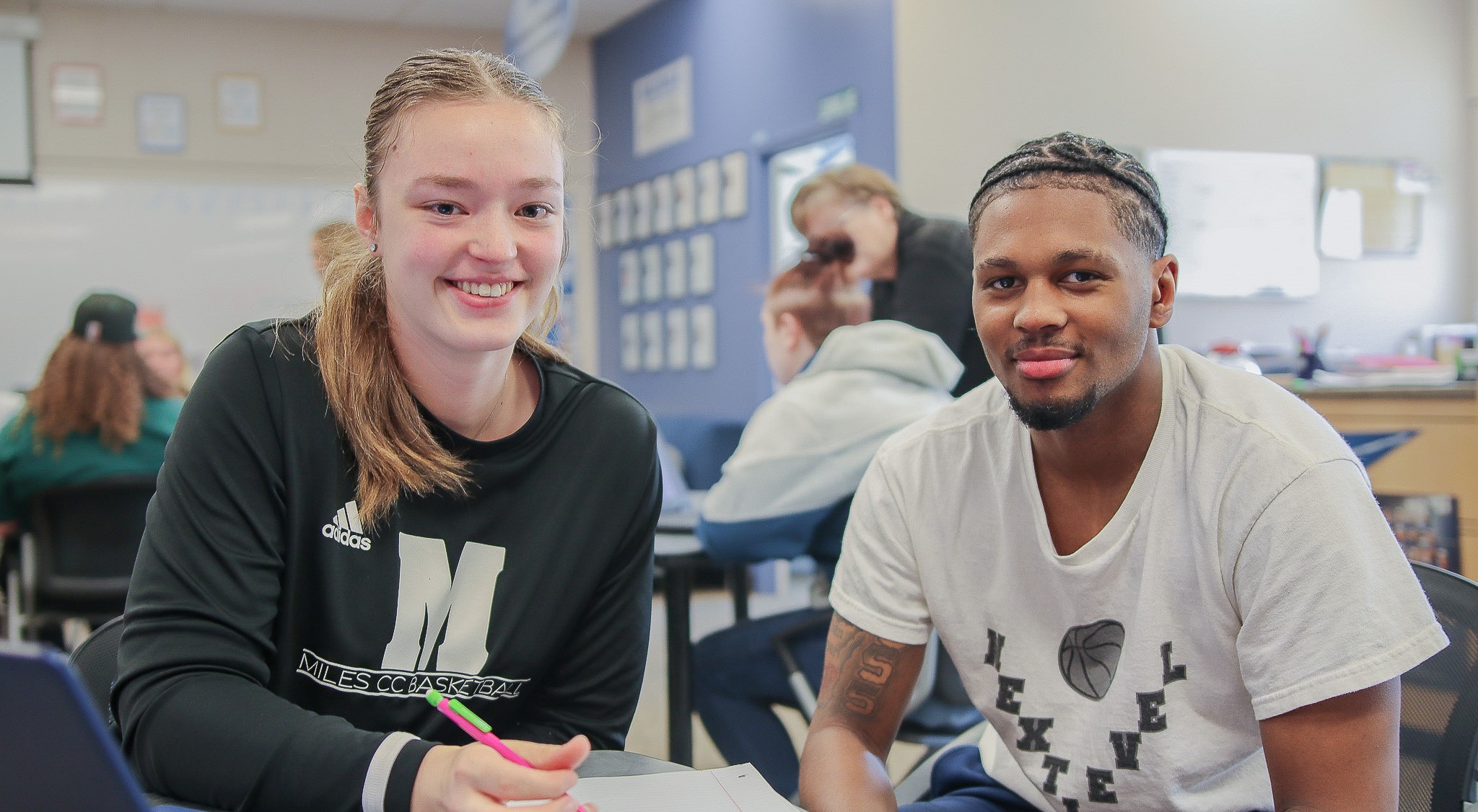 Two students smiling