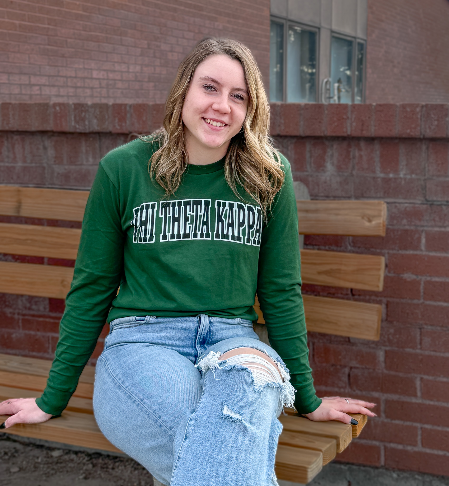 Student wearing Phi Theta Kappa shirt