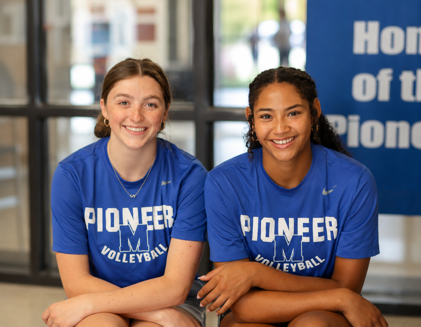 Two students smiling